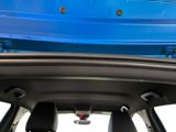 a blue car with a blue roof and a black seat