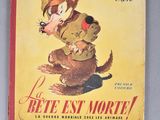 an old book with a picture of a dog on the cover