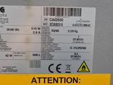 an image of a caution sign on a refrigerator door