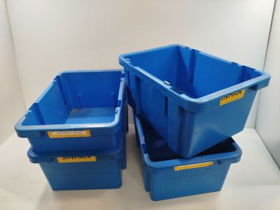 three blue plastic containers are stacked on top of each other