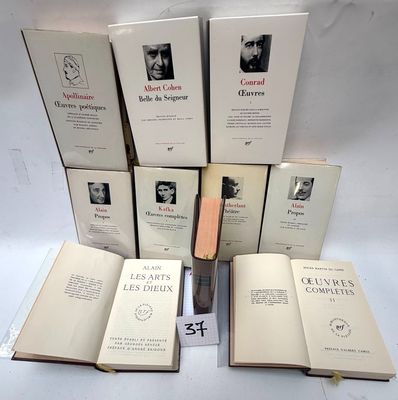 several books are stacked on top of each other on a table