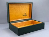 a close up of a box with a watch inside of it