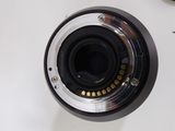 a close up of a camera lens on a white surface