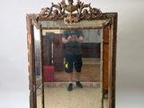 a man taking a picture of himself in a mirror