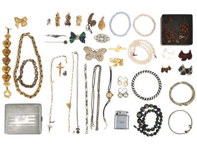 many different types of jewelry on a white surface