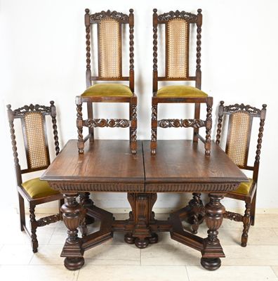 four chairs and a table that are sitting on a tile floor