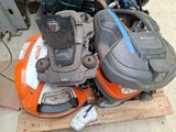two lawn mowers that are sitting on a pallet