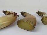 three pieces of horn horn are sitting next to each other