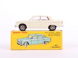 a white toy car sitting on top of a box