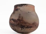 a vase with a picture of a beach scene on it