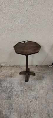 a small table that is sitting on the concrete floor