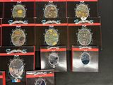 a lot of watches that are on display on a table