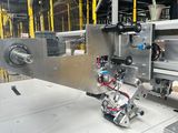 an image of a machine that is working on a piece of metal