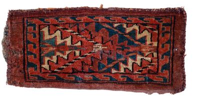a red and blue rug on a white background