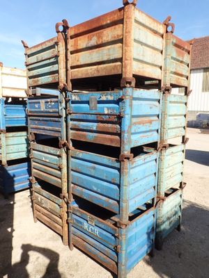 many blue crates stacked on top of each other