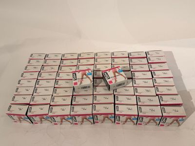 boxes of cigarettes stacked on top of each other on a white surface