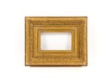 an old gold picture frame on a white background