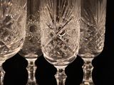 four wine glasses sitting on top of each other on a table