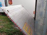 a truck that has its door open on the side of the road