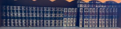 a lot of books that are on a shelf