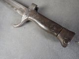 a small knife that is laying on top of a table