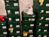 several green boxes stacked on top of each other in a room