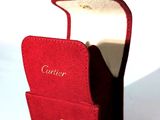 a small red case with a gold clasp on it