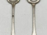 two silver spoons and a spoon with a spoon handle