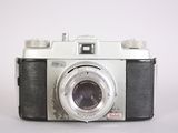 a camera that is sitting on a white surface
