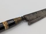 a knife that is sitting on a table