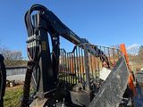 the back end of a ski - loader parked on the side of a road