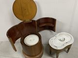 a toilet with a wooden seat next to a wooden stool