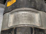 a close up of a metal object with a yellow tag on it