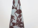 a glass vase with a floral design on it