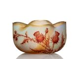 a small bowl with a flower design on it