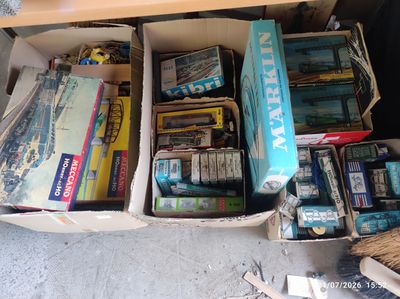 a lot of books and toys in a box on the floor