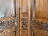 a large wooden door with carvings on it