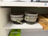 two baskets that are on a shelf in a store