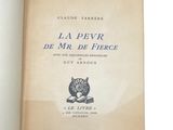 an open book with a picture of a cat sitting on top of it