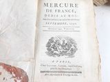 an old book with a picture of a man riding a horse