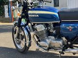 a blue motorcycle parked in front of a building