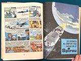 a person holding a comic book open to a page