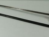 two old swords are sitting on a table next to each other