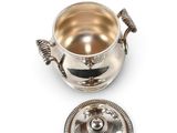 a silver plated bowl with a lid and a lid on a white background