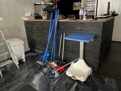 a picture of a room with a bar and tools on the floor