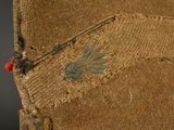 a close up view of a piece of cloth with a small insect on it