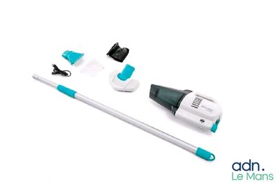 a close up of a mop and cleaning kit on a white surface