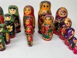 a lot of russian nesting dolls on a white surface