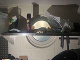 a kitchen with a lot of clutter on the counter