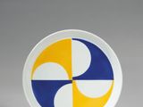 a white plate with a yellow and blue design on it